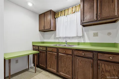 a view of a workspace with furniture