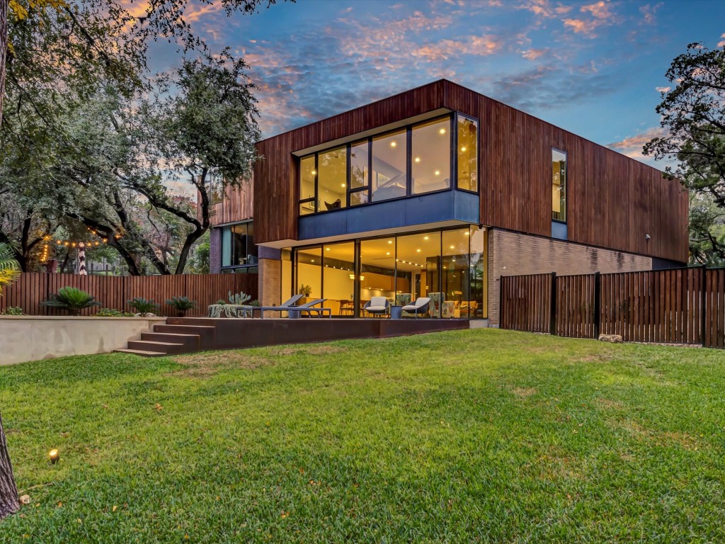 Modern Masterpiece - notice all the windows overlooking this .42 acre property!