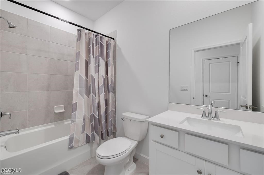 9146 Leatherwood Loop Lehigh Acres, FL 33936 - Photo 27 of 43 a bathroom with a sink toilet and shower