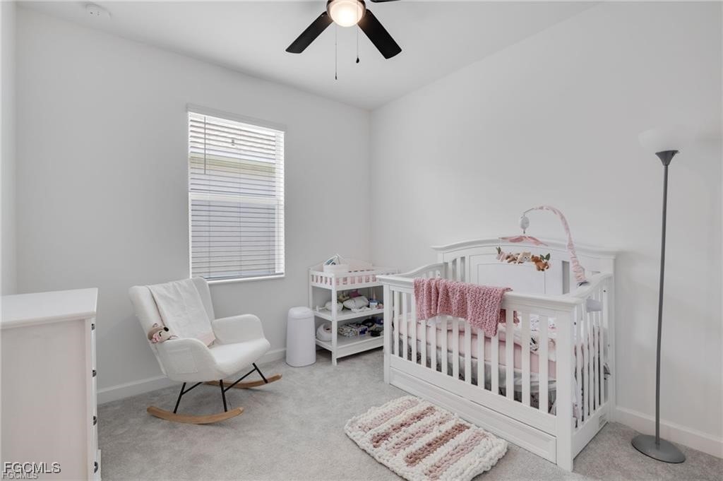 9146 Leatherwood Loop Lehigh Acres, FL 33936 - Photo 30 of 43 a bedroom with furniture and a window