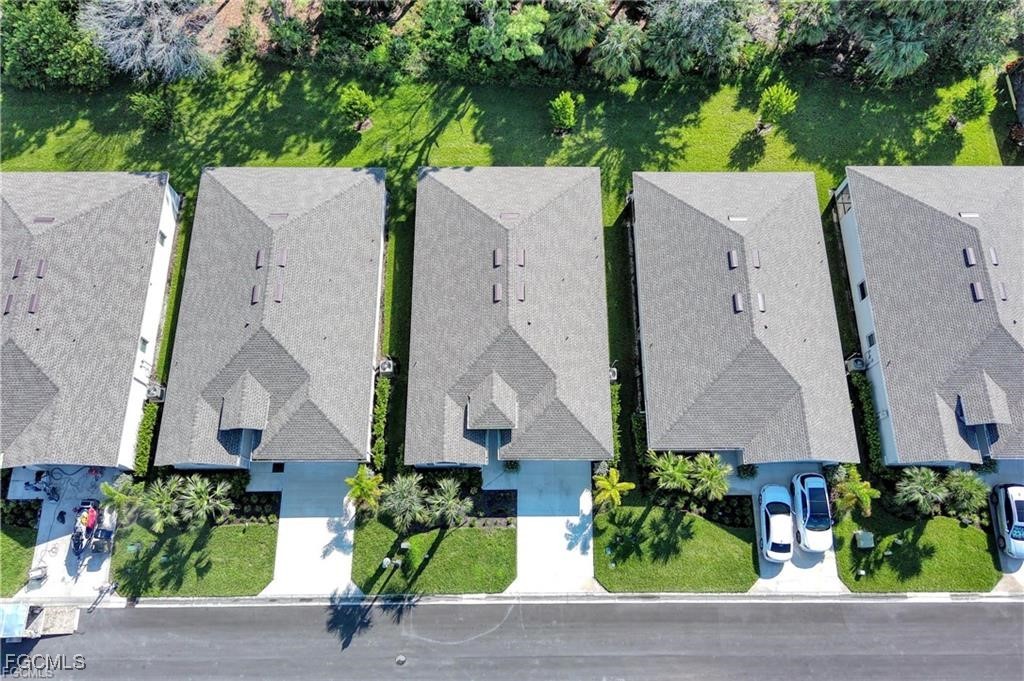 9146 Leatherwood Loop Lehigh Acres, FL 33936 - Photo 3 of 43 an aerial view of a house