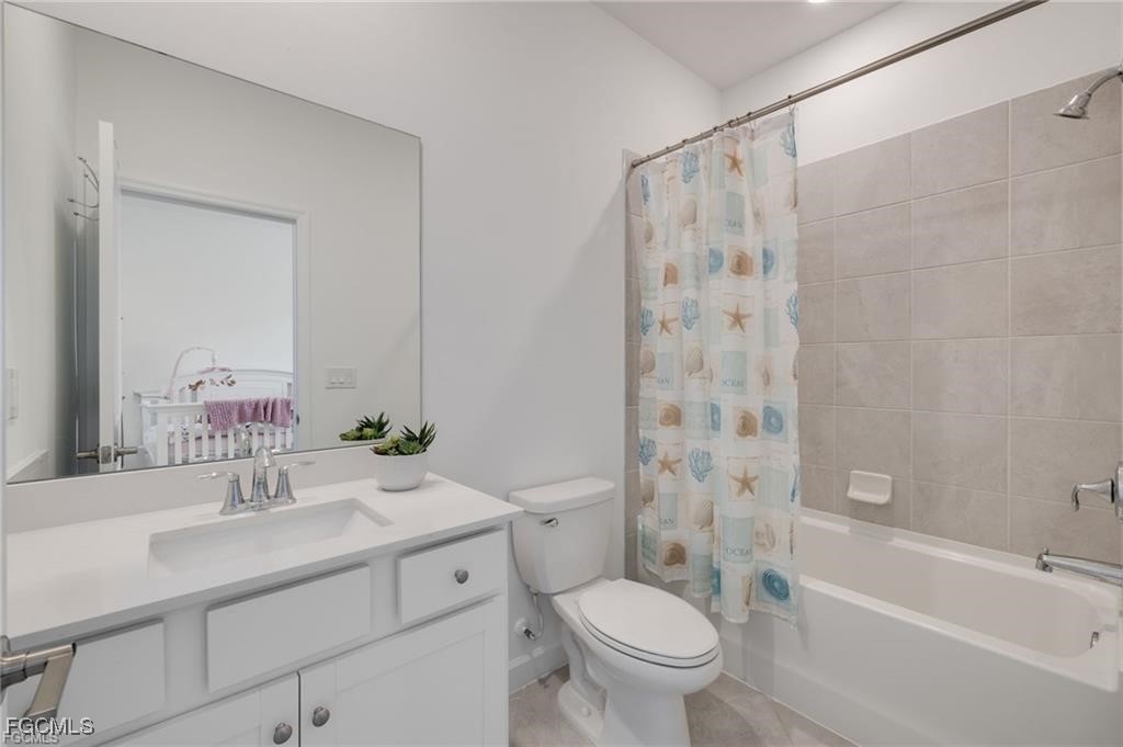 9146 Leatherwood Loop Lehigh Acres, FL 33936 - Photo 31 of 43 a bathroom with a sink toilet and shower