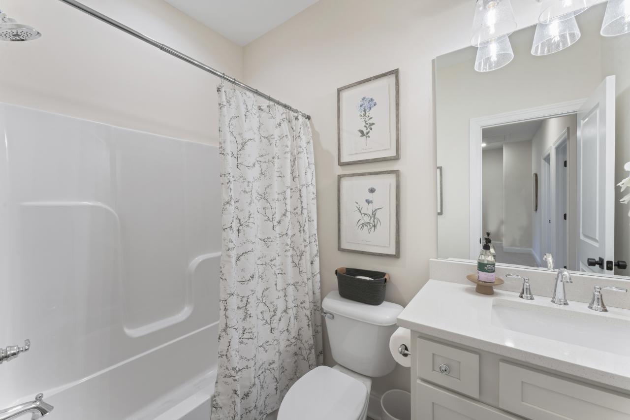 2128 Gracie Bug Loop Murfreesboro, TN 37128 - Photo 13 of 23 a bathroom with a sink toilet and shower