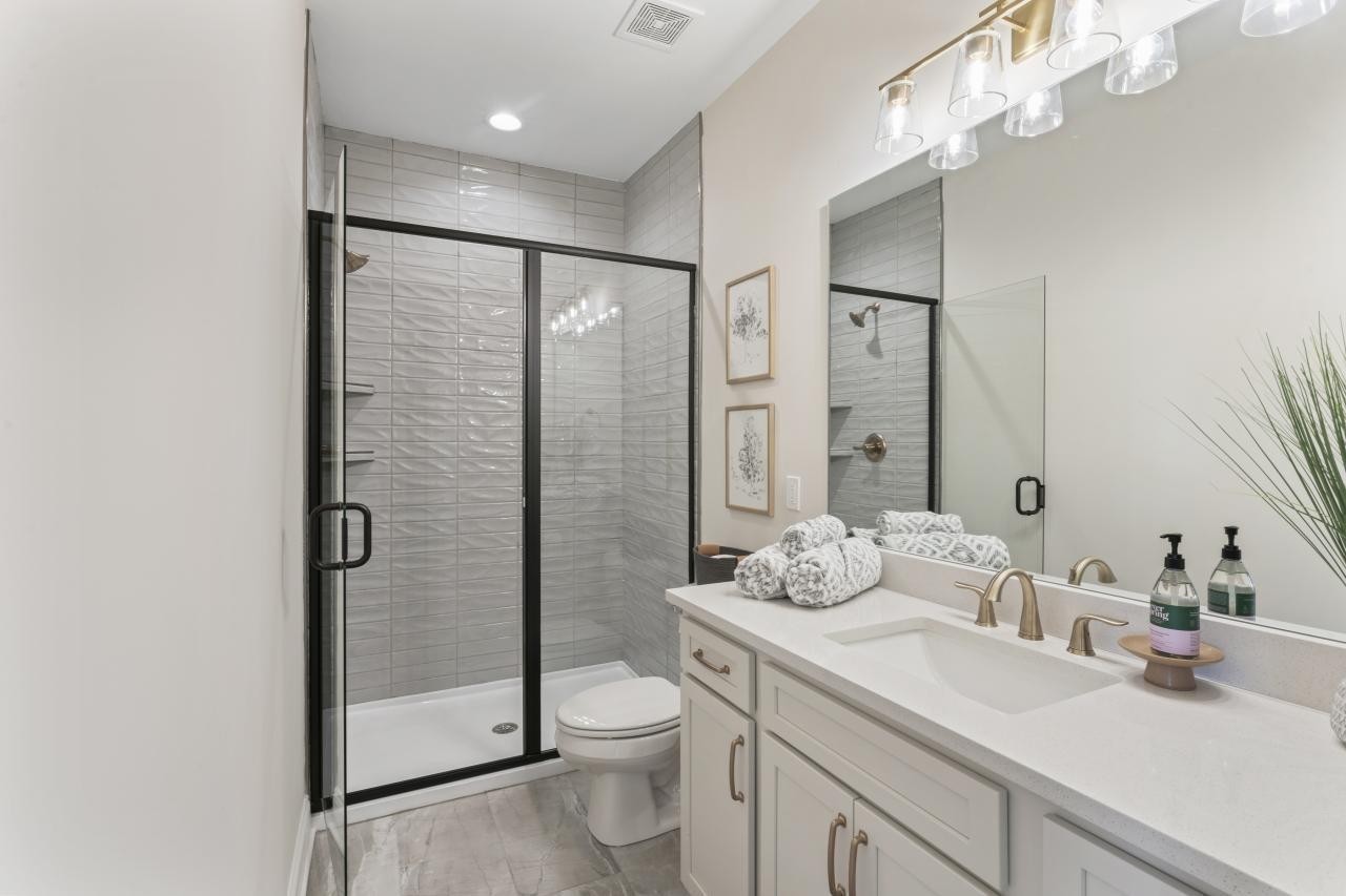 2128 Gracie Bug Loop Murfreesboro, TN 37128 - Photo 14 of 23 a bathroom with a sink a toilet and shower