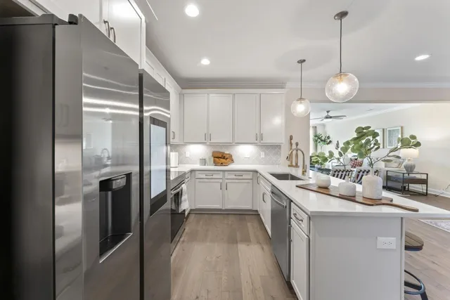 a kitchen with a refrigerator and countertop