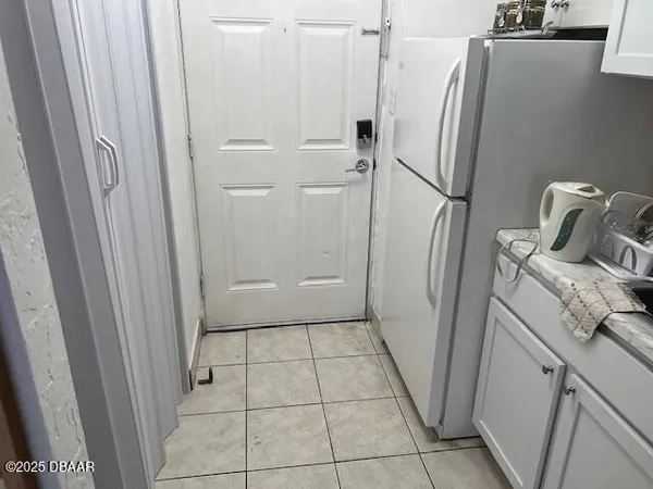 a bathroom with a granite countertop shower and a sink