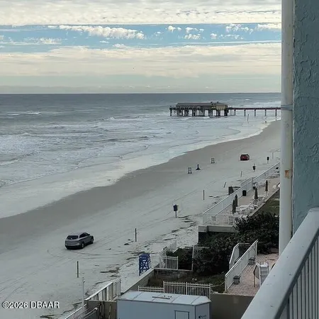 a view of a living room and entryway