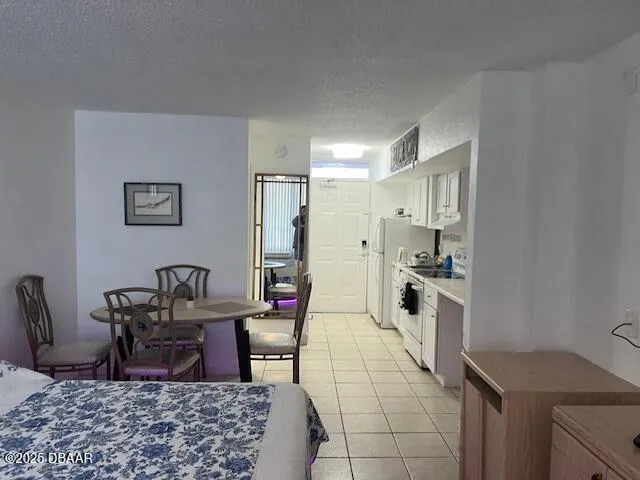 a open kitchen with stainless steel appliances kitchen island granite countertop a sink and cabinets