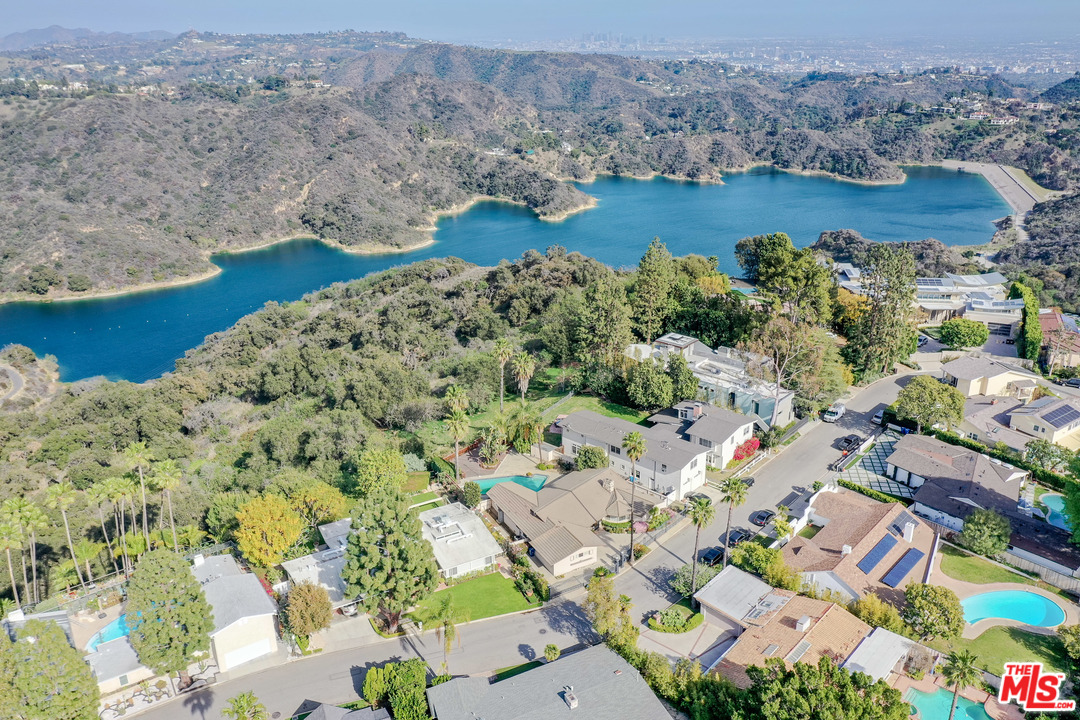 an aerial view of a house with a lake view