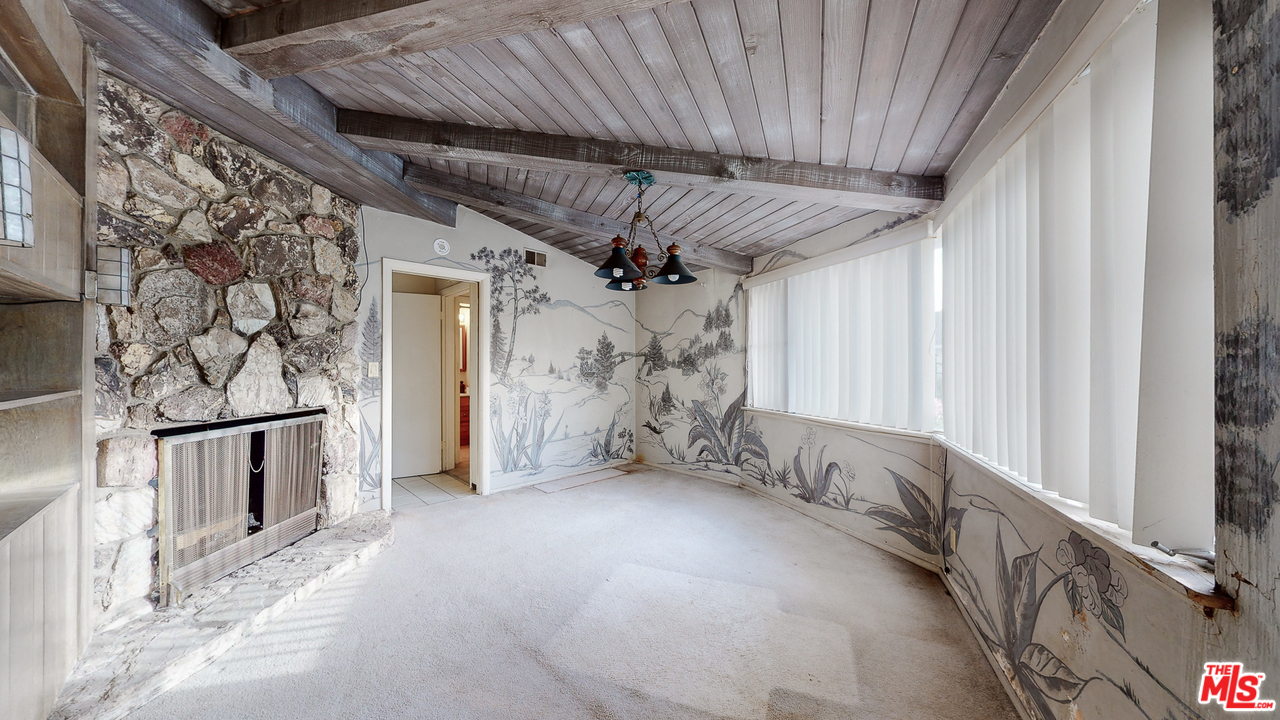 2254 Stradella Road Los Angeles, CA 90077 - Photo 16 of 29 a view of a livingroom with wooden floor