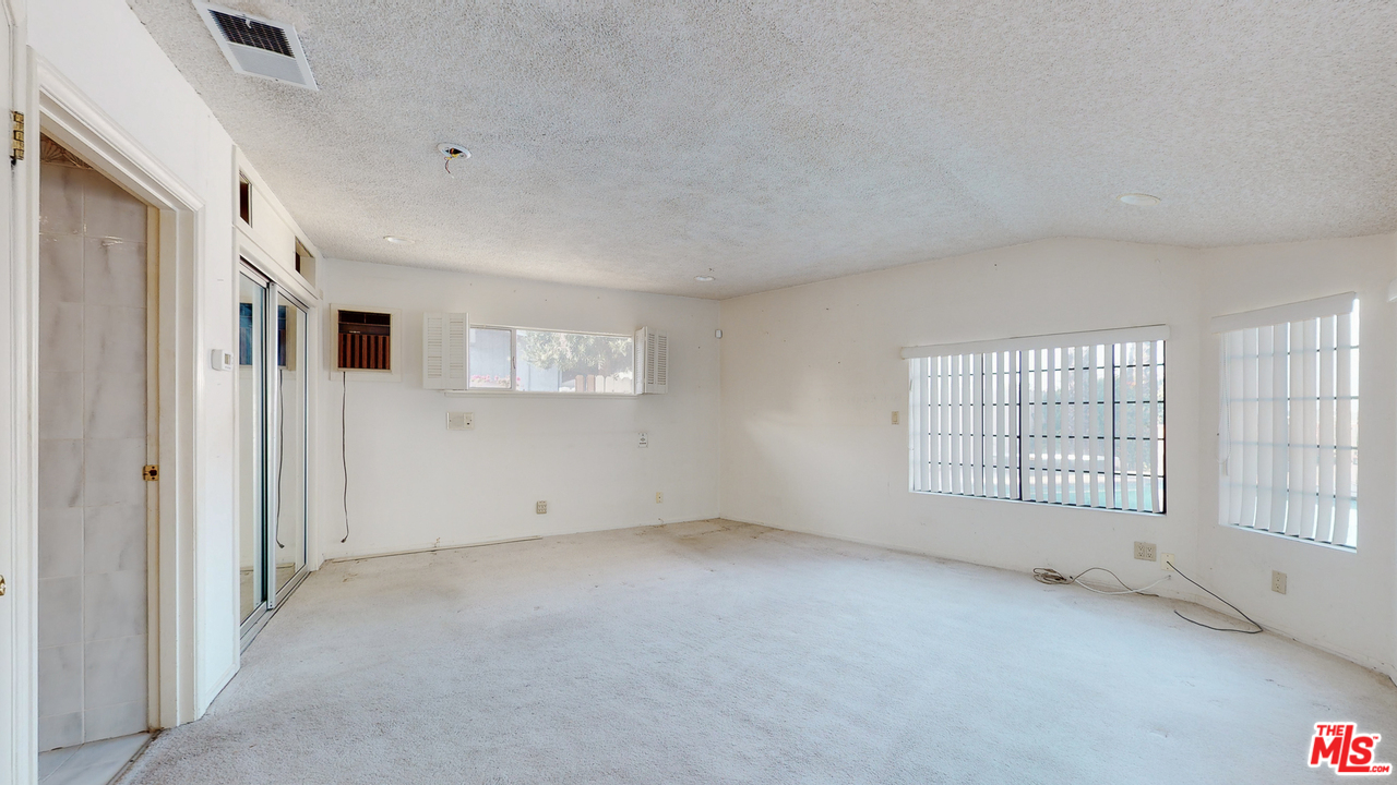 2254 Stradella Road Los Angeles, CA 90077 - Photo 17 of 29 an empty room with windows