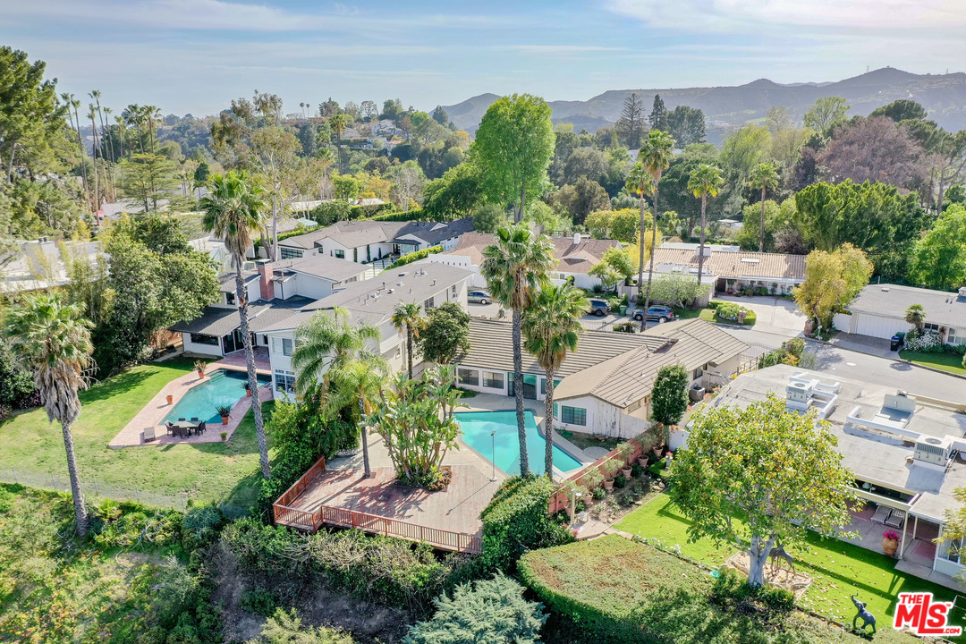 2254 Stradella Road Los Angeles, CA 90077 - Photo 3 of 29 an aerial view of a house with a yard and lake view
