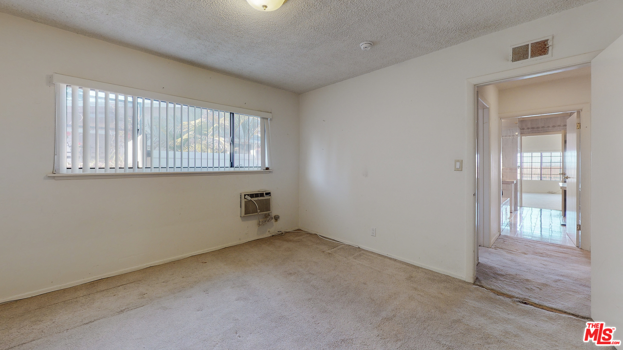 2254 Stradella Road Los Angeles, CA 90077 - Photo 22 of 29 an empty room with windows