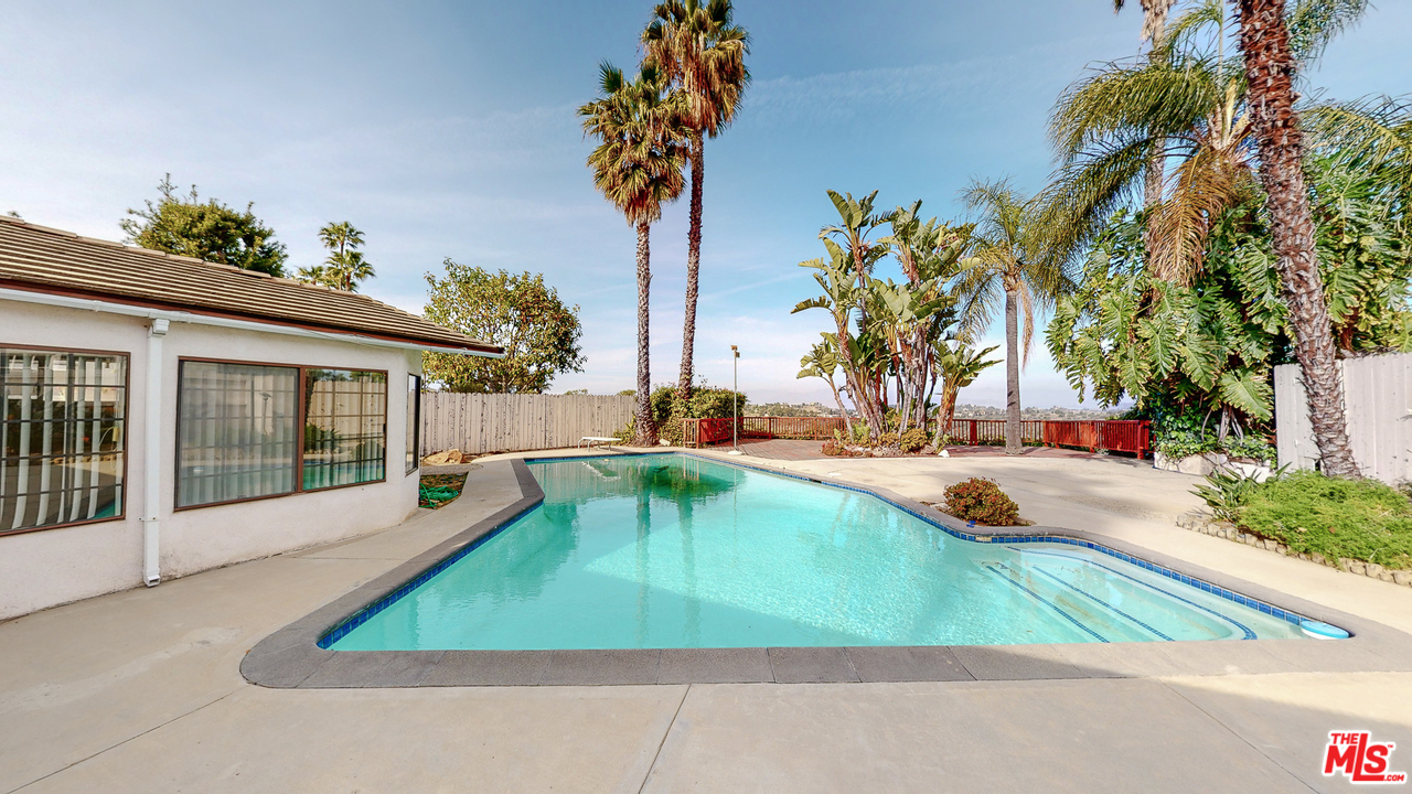 2254 Stradella Road Los Angeles, CA 90077 - Photo 23 of 29 a view of a swimming pool with an outdoor seating