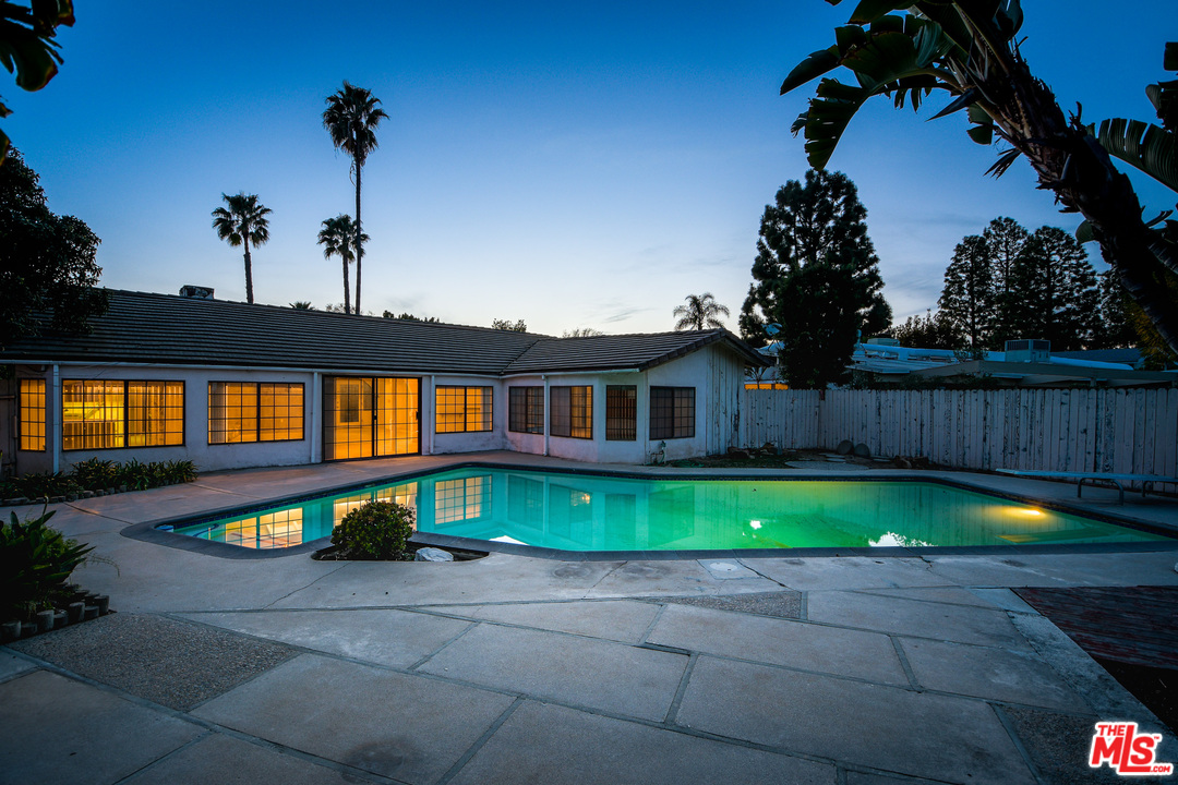 2254 Stradella Road Los Angeles, CA 90077 - Photo 26 of 29 a front view of a house with swimming pool having outdoor seating