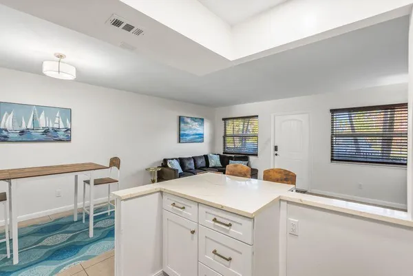 a view of kitchen with cabinets and wooden floor