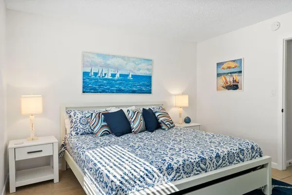 a bedroom with a bed and a cabinets