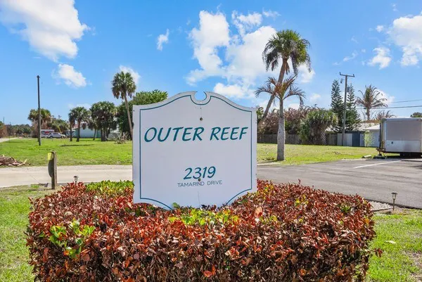 a sign on the side of the road