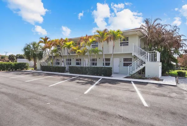 a kitchen with a stove a sink and a refrigerator