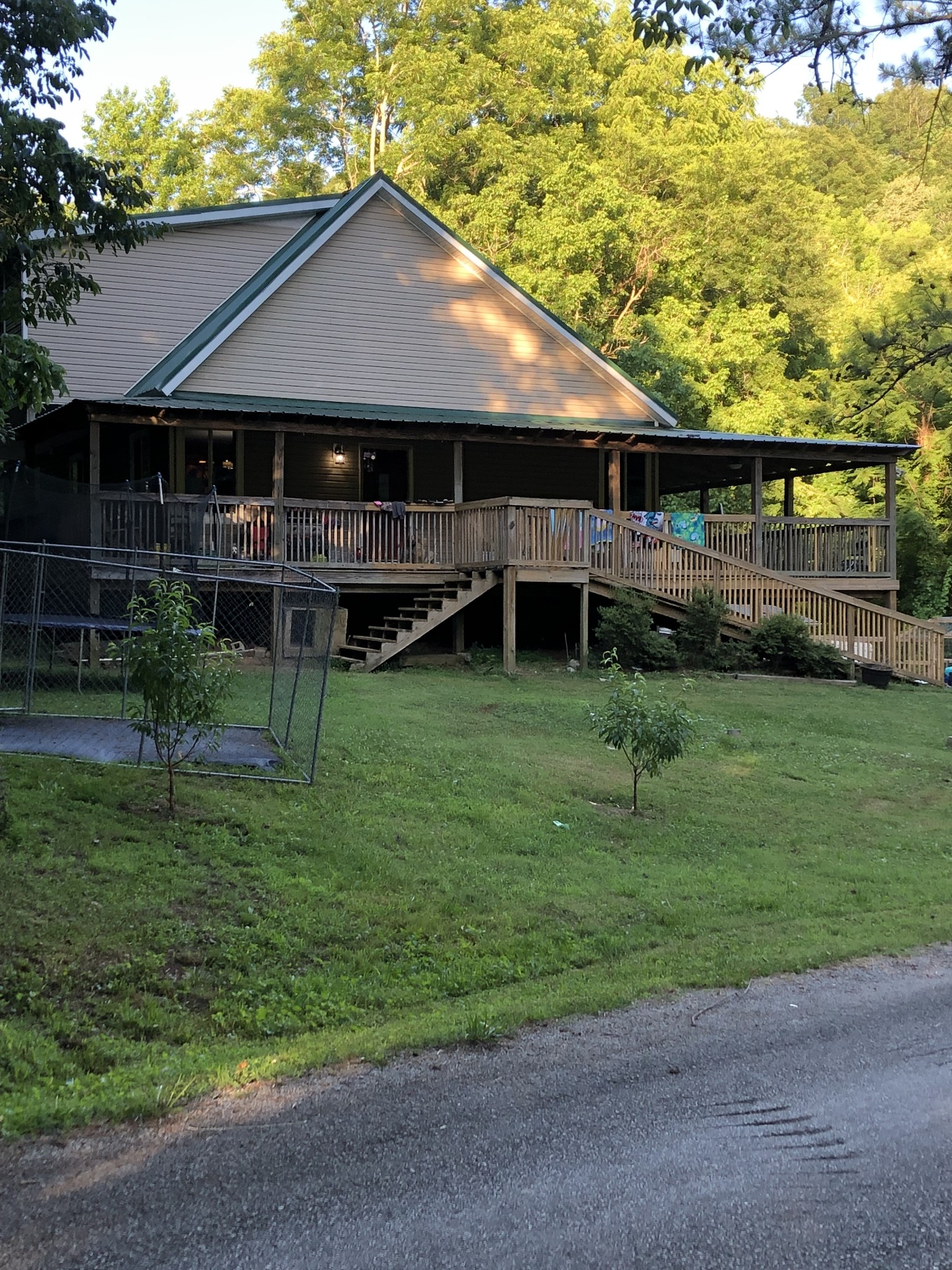 2053 Dog Branch Road Prospect, TN 38477 - Photo 1 of 25 a backyard of a house with table and chairs