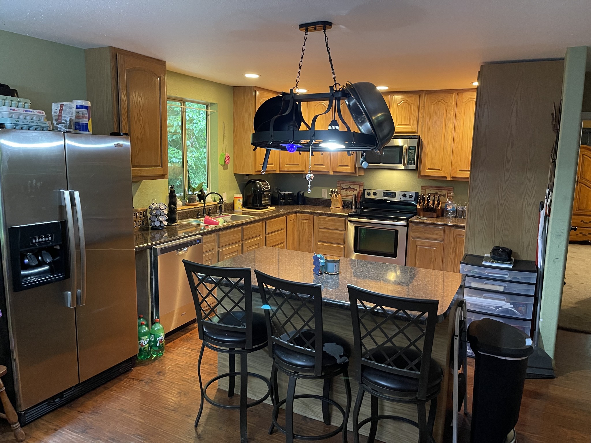 2053 Dog Branch Road Prospect, TN 38477 - Photo 5 of 25 a kitchen with stainless steel appliances a dining table chairs stove and refrigerator