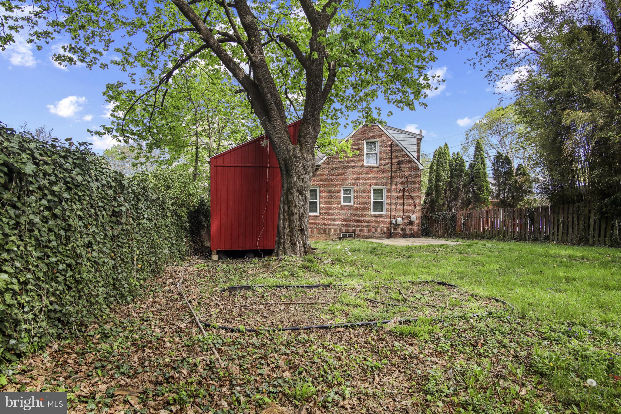 608 Farmhurst Road Baltimore, MD 21208 - Photo 45 of 45 a backyard of a house with lots of green space