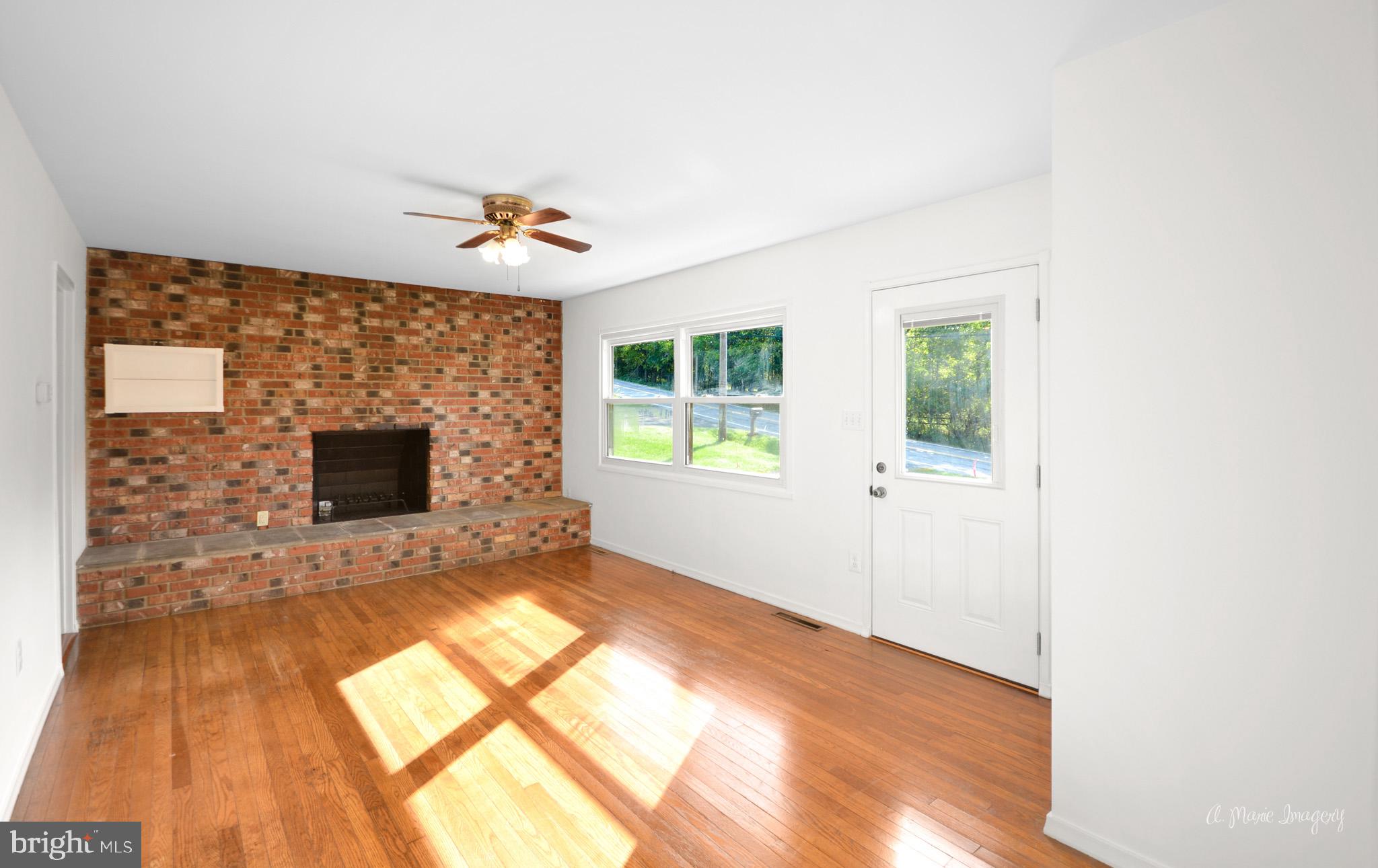 5902 Quinn Road Frederick, MD 21701 - Photo 5 of 37 Main level fireplace in family room