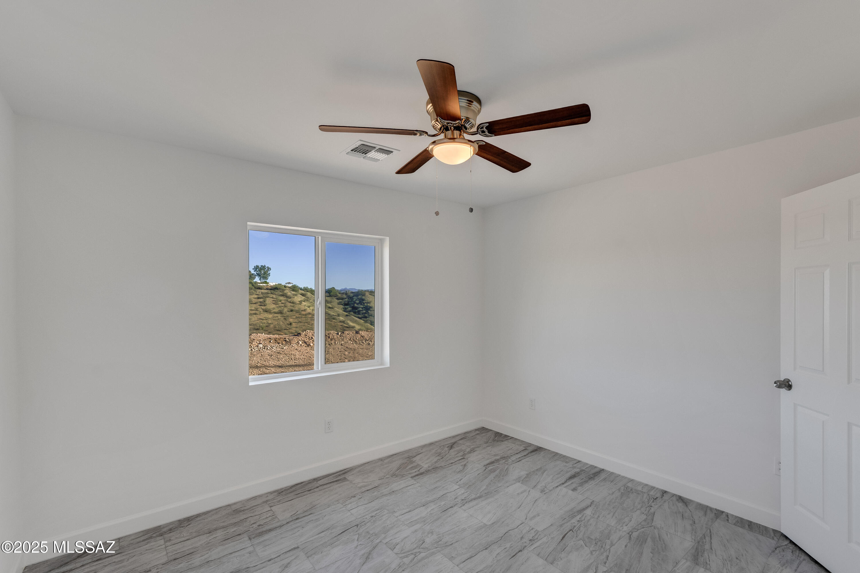 329 Camino Magnifico Rio Rico, AZ 85648 - Photo 25 of 47 a view of room with window ceiling fan