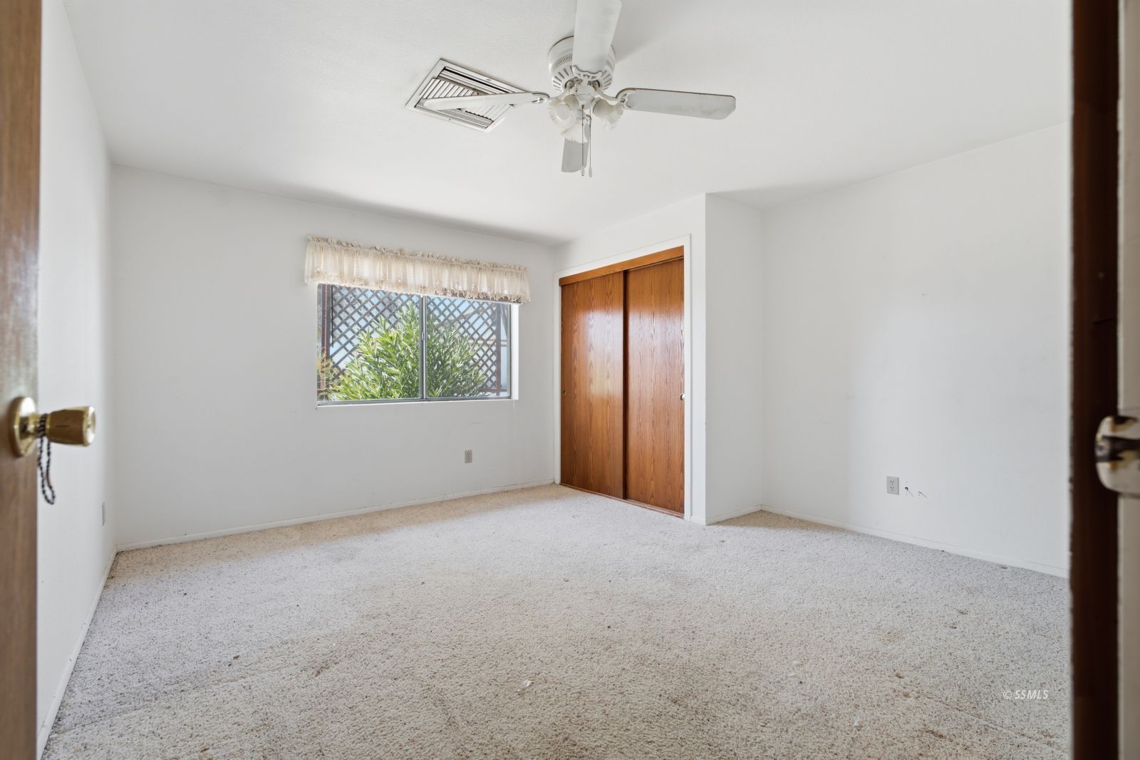 3443 3rd Street Inyokern, CA 93527 - Photo 13 of 24 an empty room with windows and fan