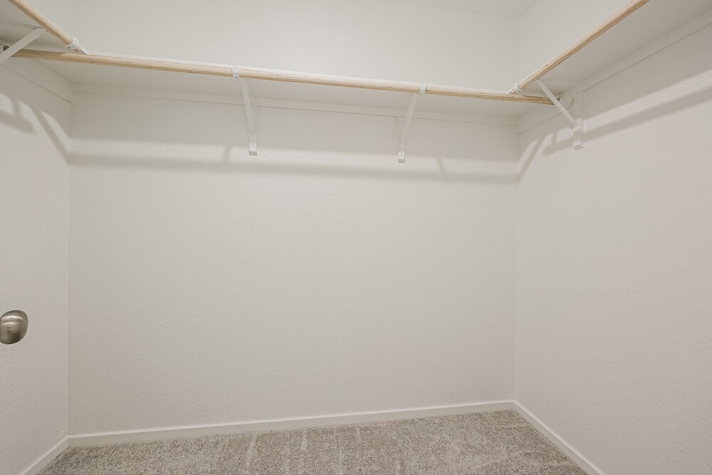 621 Craven Street Conroe, TX 77316 - Photo 11 of 16 a view of small space with racks on the wall