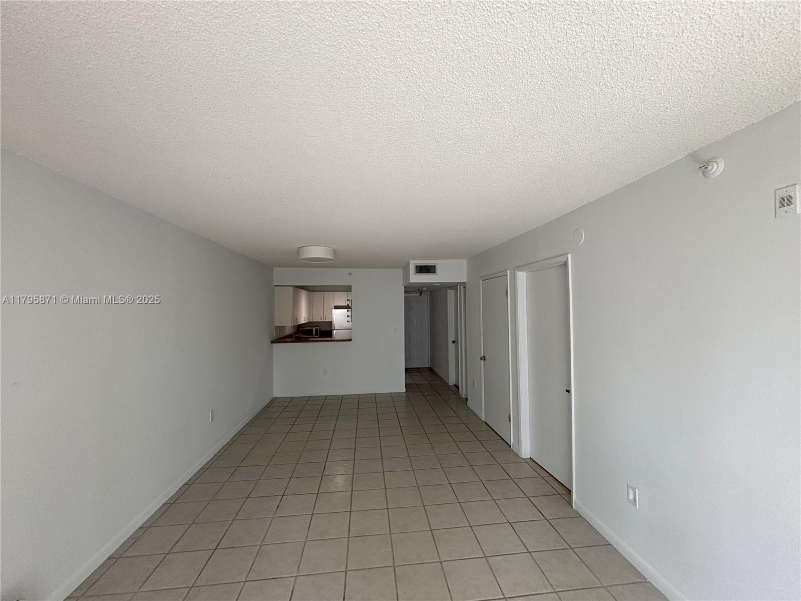 126 Southwest 17th Road, Unit 505 Miami, FL 33129 - Photo 11 of 23 a view of an empty room and a window