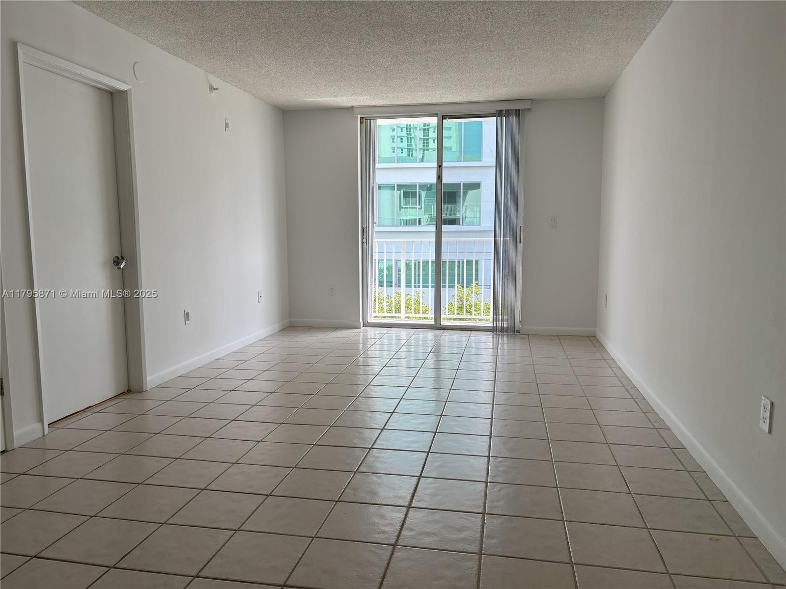 126 Southwest 17th Road, Unit 505 Miami, FL 33129 - Photo 13 of 23 a view of an empty room and window