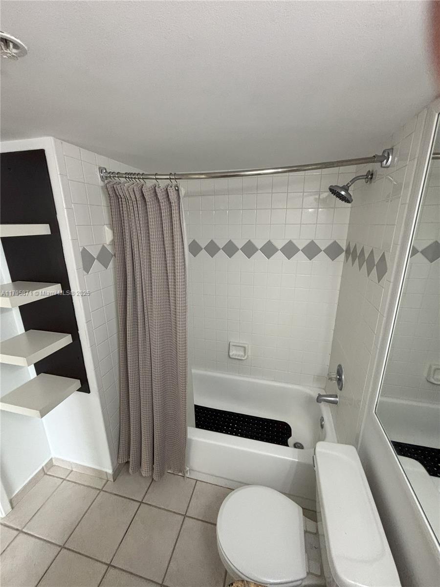 126 Southwest 17th Road, Unit 505 Miami, FL 33129 - Photo 8 of 23 a bathroom with a toilet and a shower