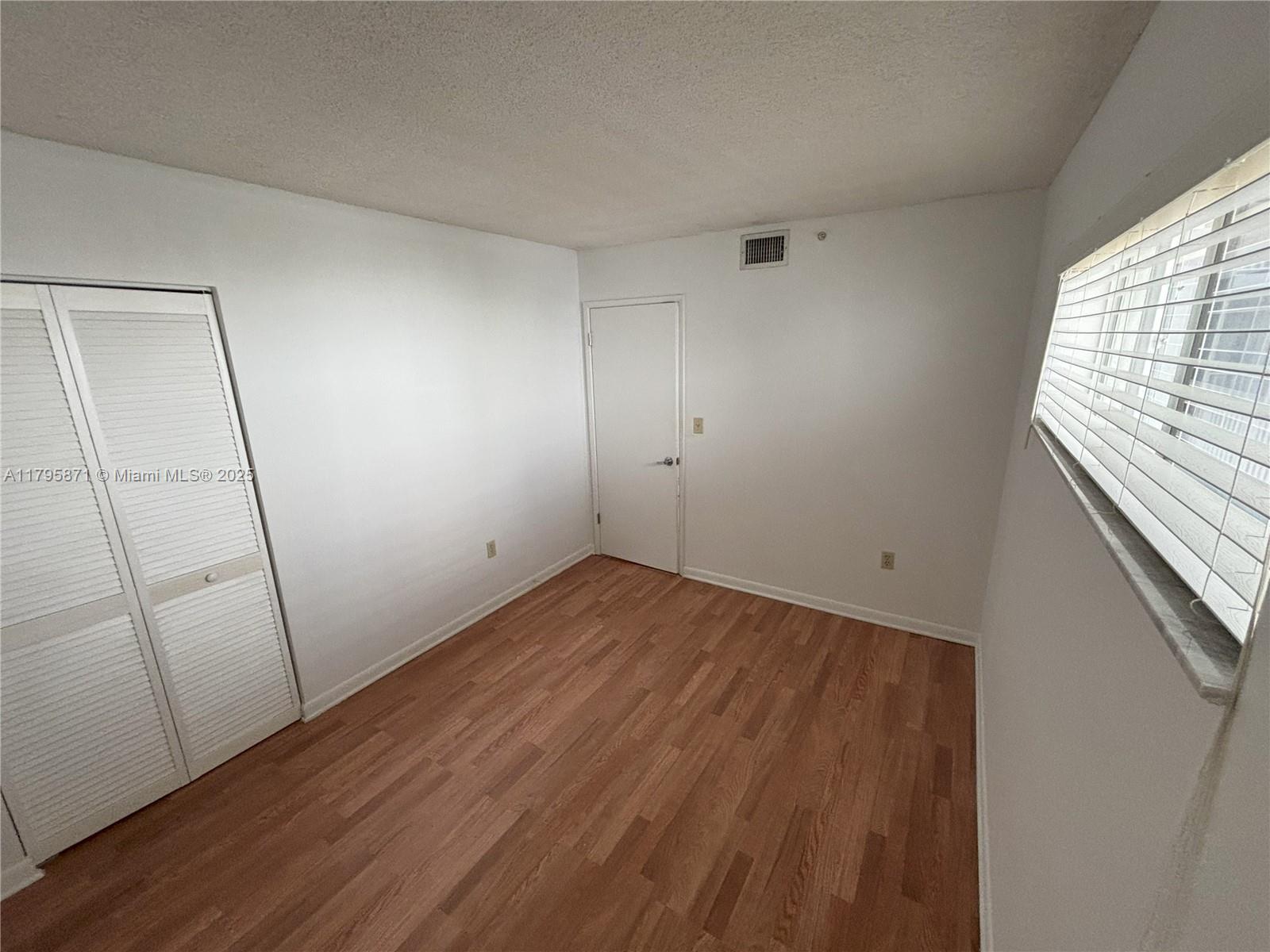 126 Southwest 17th Road, Unit 505 Miami, FL 33129 - Photo 10 of 23 a view of a room with wooden floor
