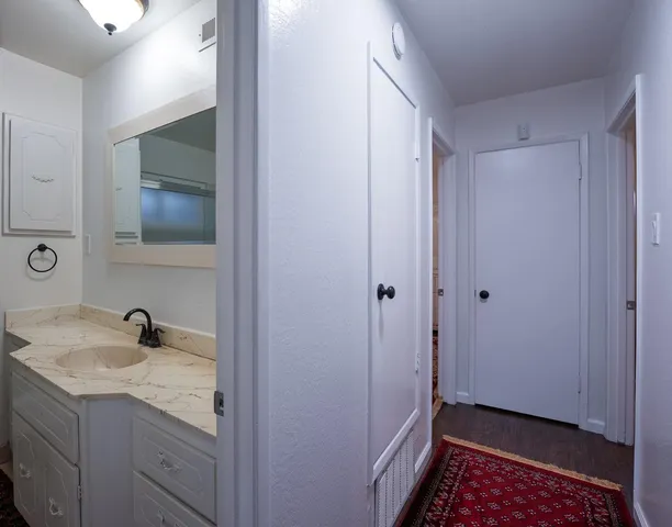 a living room with furniture fireplace and flat screen tv