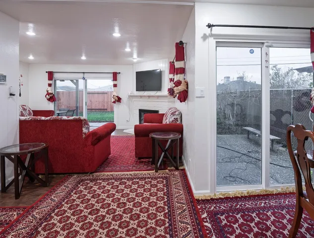 a view of a house with backyard porch and sitting area