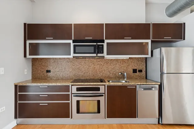 a dining room with furniture and a floor to ceiling window