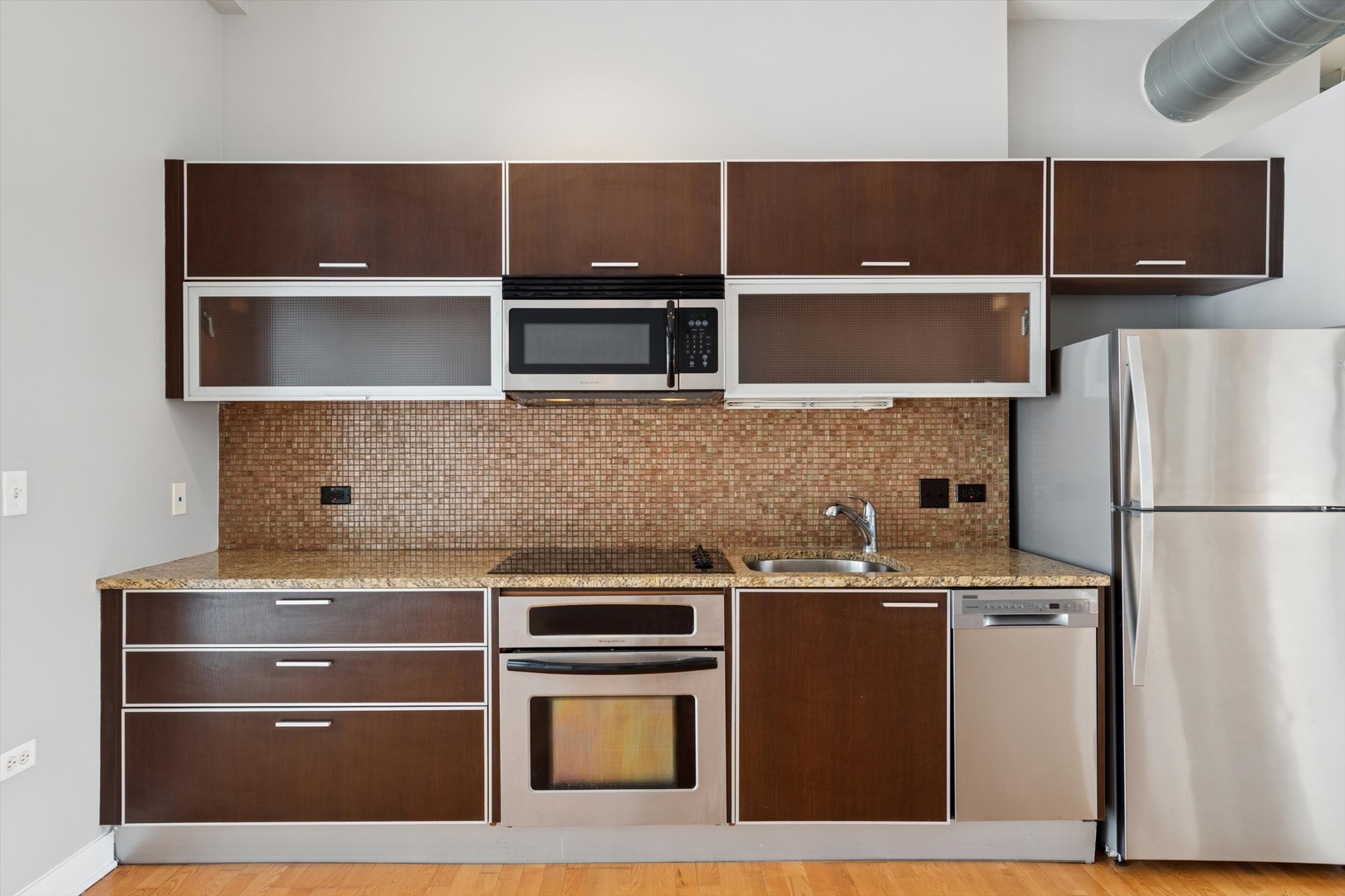 660 West Wayman Street, Unit 501 Chicago, IL 60661 - Photo 3 of 22 a kitchen with cabinets and stainless steel appliances