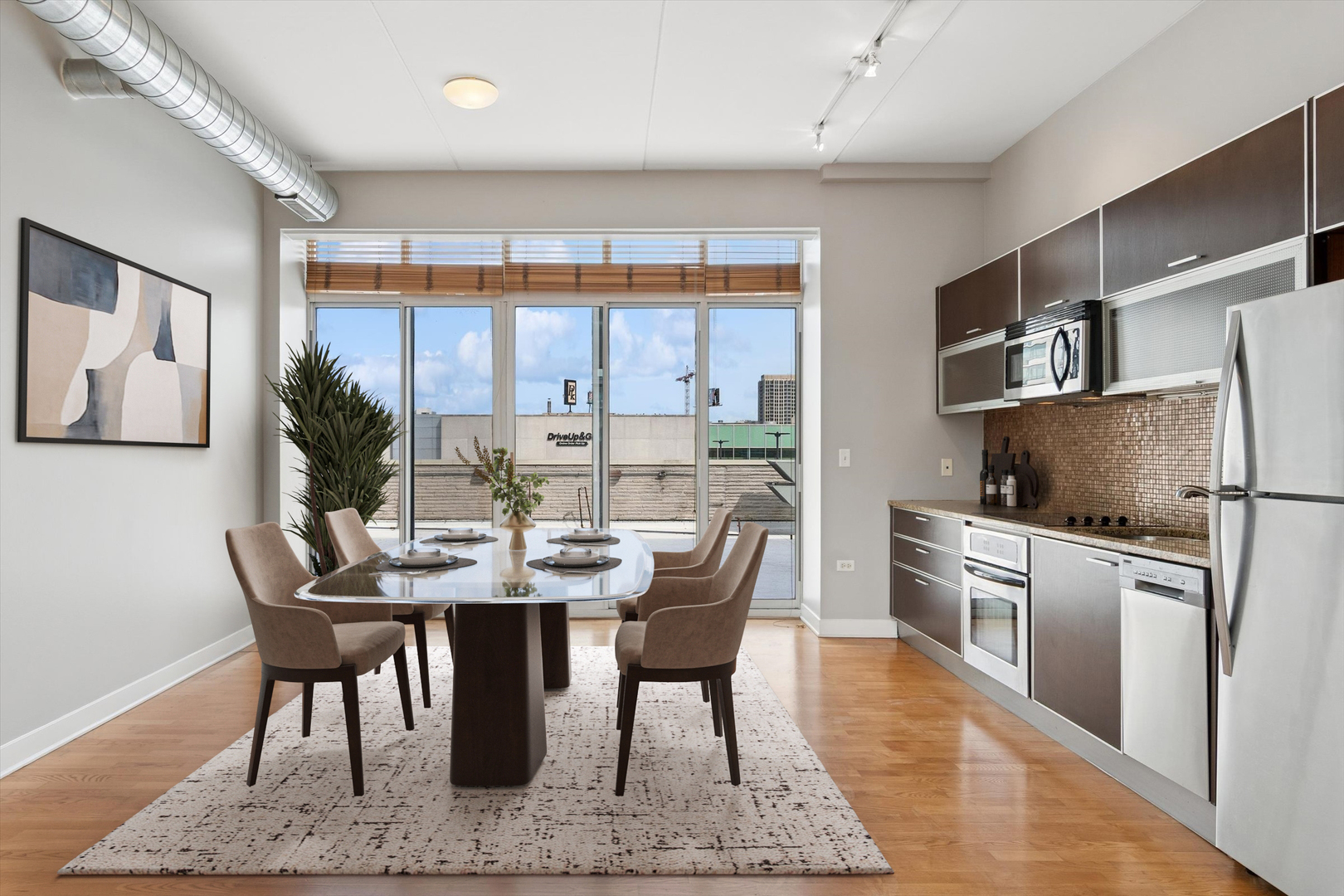 660 West Wayman Street, Unit 501 Chicago, IL 60661 - Photo 4 of 22 a dining room with furniture and a floor to ceiling window