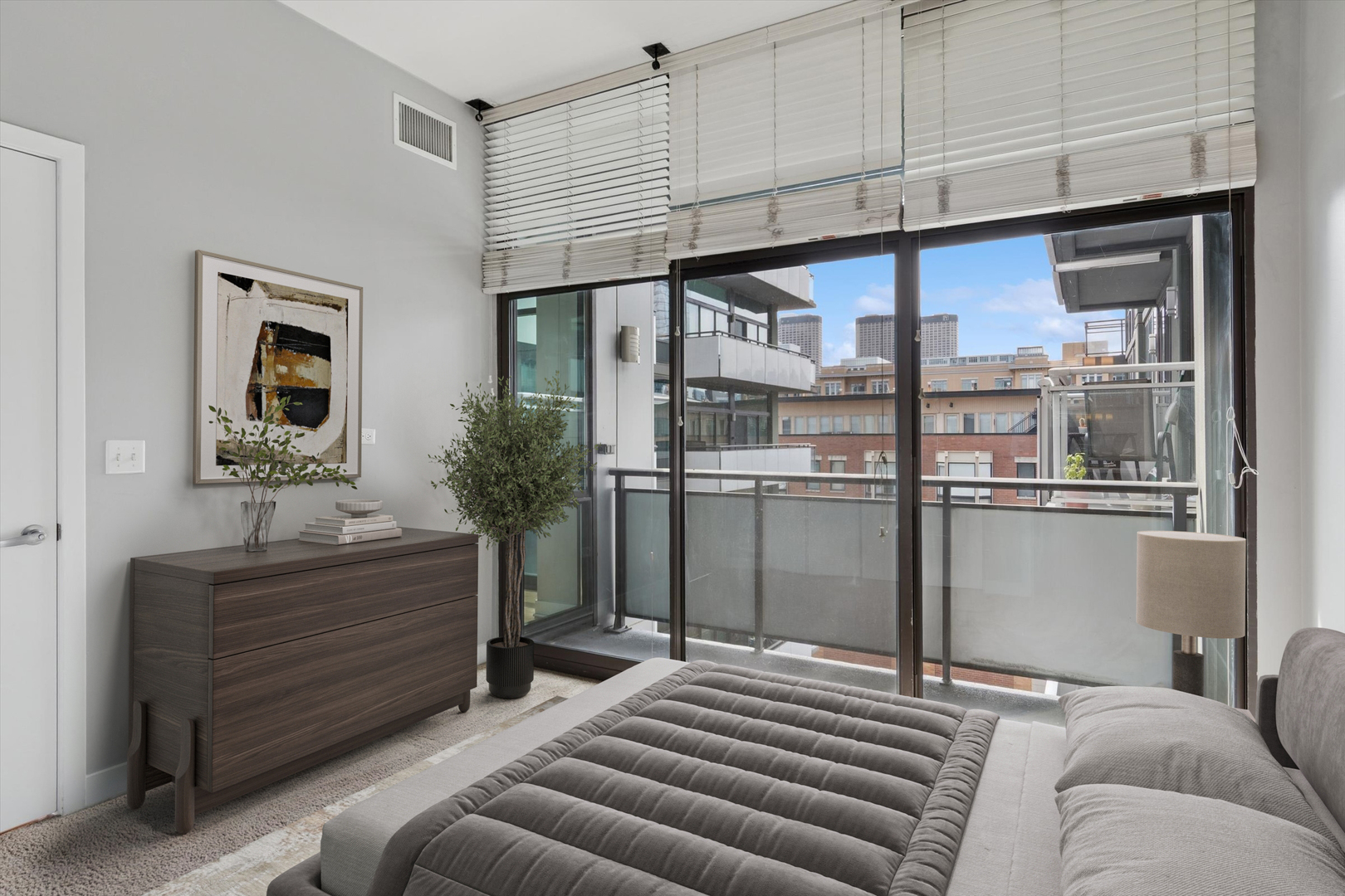 660 West Wayman Street, Unit 501 Chicago, IL 60661 - Photo 10 of 22 a bedroom with a bed and a cabinets