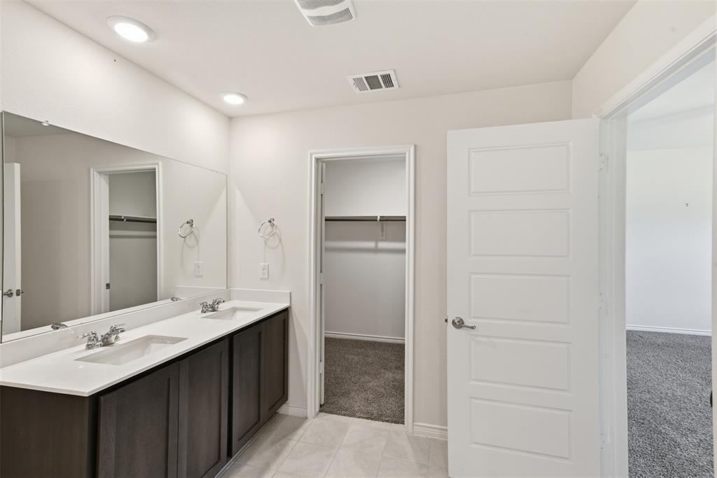 415 Boston Road Fate, TX 75189 - Photo 21 of 40 Primary bath with double sinks