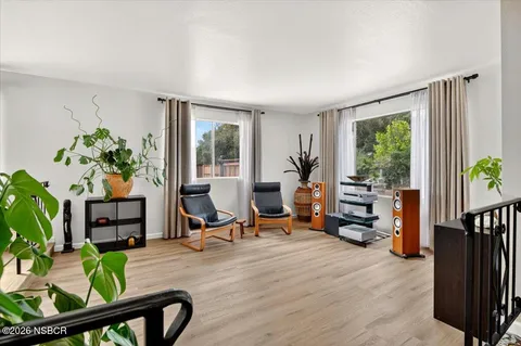 a living room with furniture gym and a window
