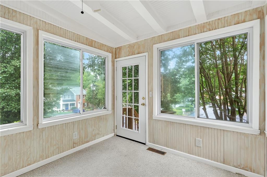 2197 Spring Walk Court Atlanta, GA 30341 - Photo 14 of 31 a view of an empty room with large windows