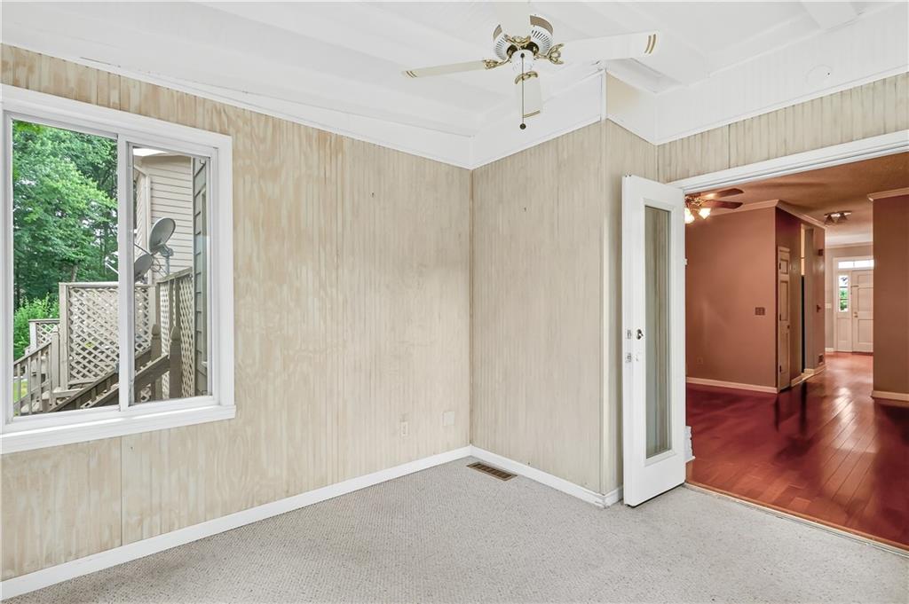2197 Spring Walk Court Atlanta, GA 30341 - Photo 15 of 31 wooden floor in an empty room with a window