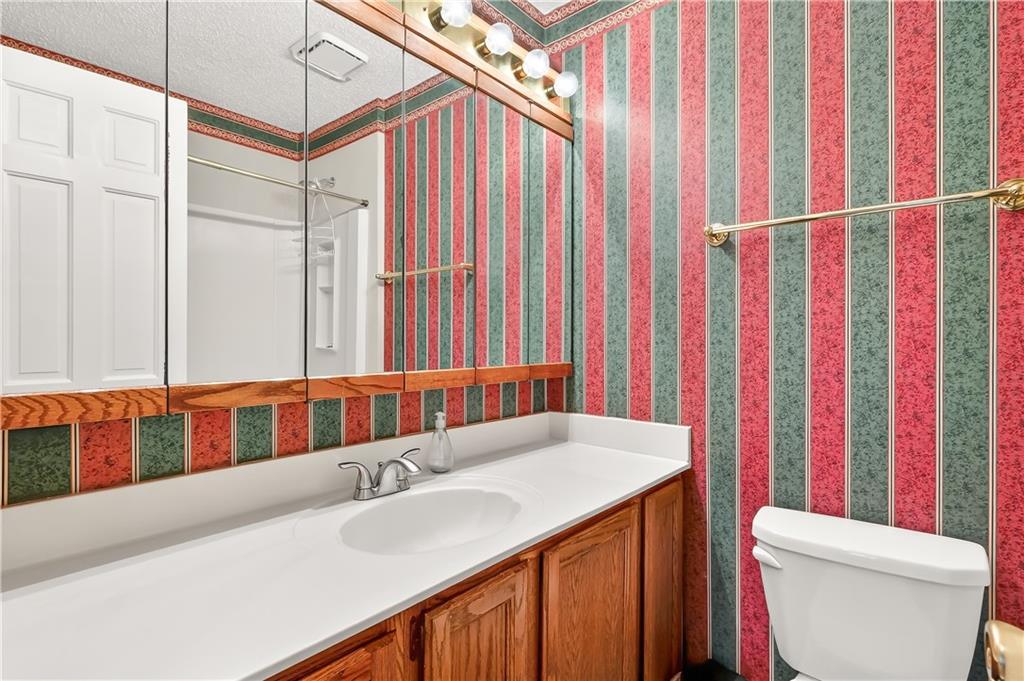 2197 Spring Walk Court Atlanta, GA 30341 - Photo 18 of 31 a bathroom with a sink and a toilet