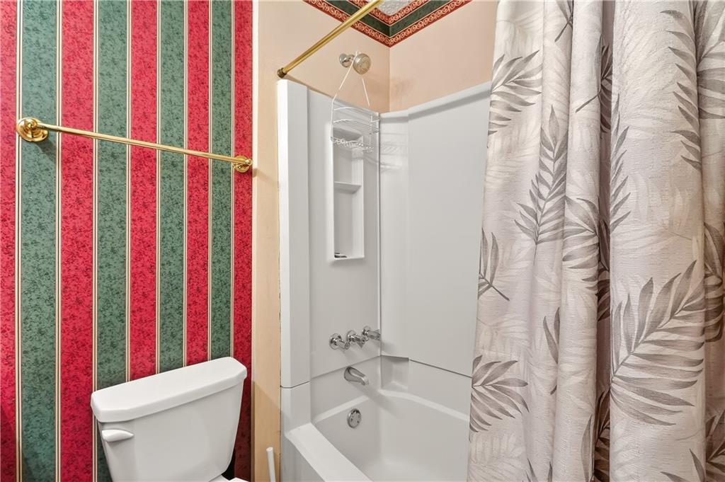 2197 Spring Walk Court Atlanta, GA 30341 - Photo 19 of 31 a bathroom with a toilet and a bathtub
