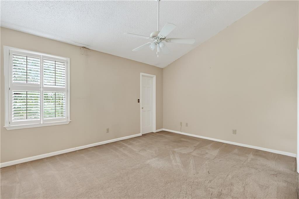 2197 Spring Walk Court Atlanta, GA 30341 - Photo 21 of 31 an empty room with a window and a fan