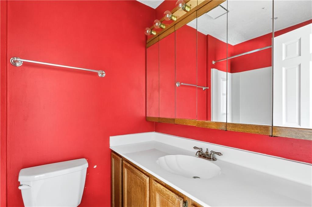 2197 Spring Walk Court Atlanta, GA 30341 - Photo 23 of 31 a bathroom with a sink and a mirror