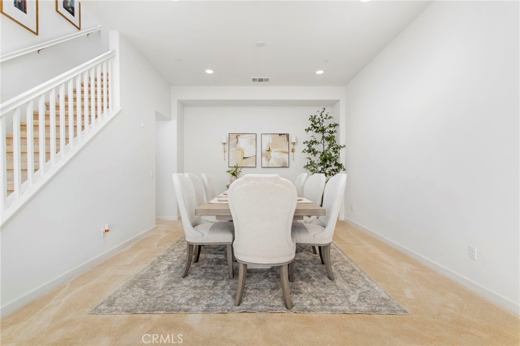 32797 Hayden Road Menifee, CA 92584 - Photo 10 of 51 a view of a dining room with furniture and wooden floor