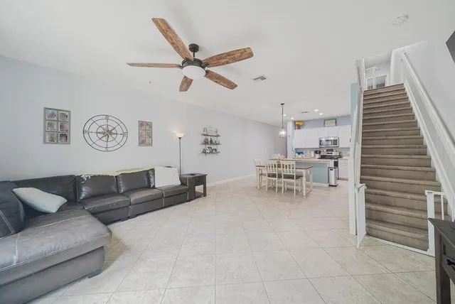 a living room with furniture and a table